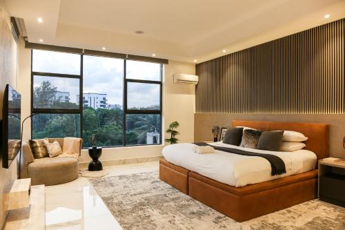 Postel nebo postele na pokoji v ubytování George Residence Cooper Road, Ikoyi