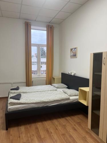 a bedroom with a bed and a window at Grassalkovich Residence in Budapest