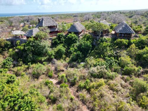 an aerial view of a house on a hill with trees at MONKEY MOUNTAIN LODGE in Mtende