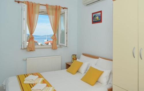 En eller flere senge i et værelse på Blue apartment, Okrug gornji - Trogir