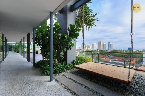 a swing hanging from the side of a building at Spacious 3BR in Tropicana 218 at Central Location & Food Hunt Friendly in George Town