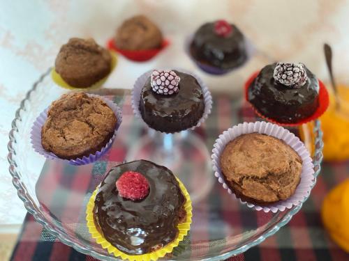 a glass plate with chocolate muffins on a table at Nekreseli in Sagarejo