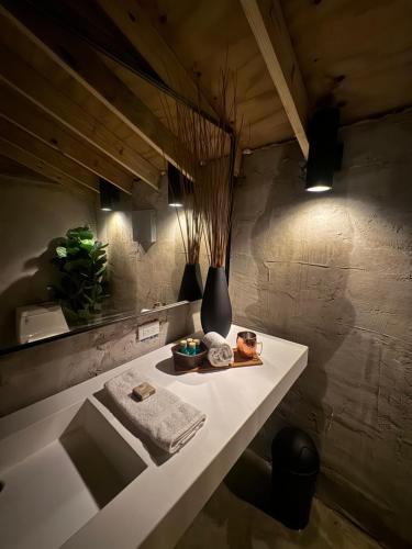 a bathroom with a table with a plate of food on it at Jardin al Bosque-Glamping in San Juan
