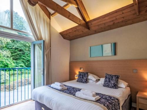 En eller flere senge i et værelse på Holiday Home Haven by Interhome