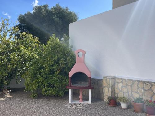 a small brick oven sitting next to a wall at Holiday Home Zaragoza by Interhome in Miami Platja