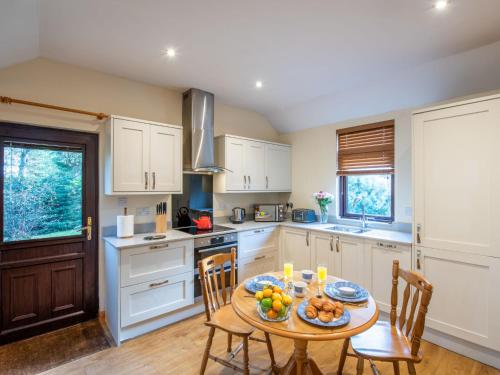 a kitchen with a table with fruit on it at Holiday Home Fishermans by Interhome in Inverness
