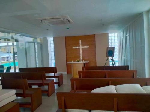 a church with a cross on the wall at BNB Staycation and Condo Rental in Cagayan de Oro