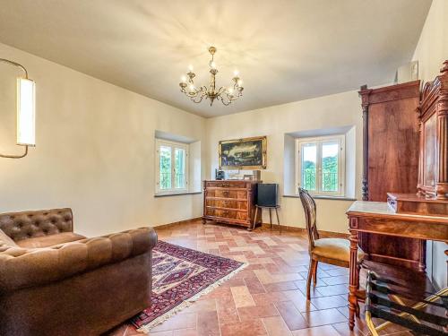 a living room with a couch and a desk at Villa Naldi Relais in San Carlo