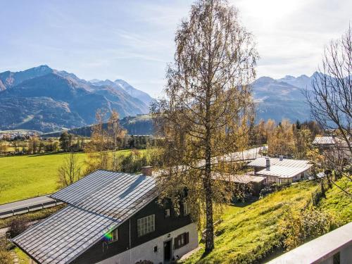 an aerial view of a house with mountains in the background at Apartment Emma-8 by Interhome in Dürnberg