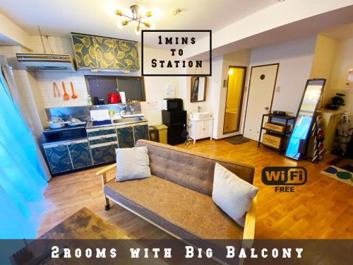 a living room with a couch and a kitchen at 1min walk to sta, drct bus to HND! Easy access! 01 in Tokyo