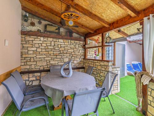 a dining room with a table and chairs at Holiday Home Bonita by Interhome in Šišan