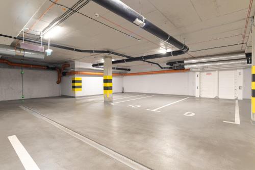 an empty parking lot in a parking garage at SuperApart Sternicza apt 43 in Warsaw