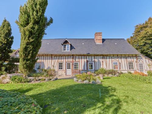 a large house with a yard in front of it at Holiday Home La longère by Interhome in Vatteville-la-Rue