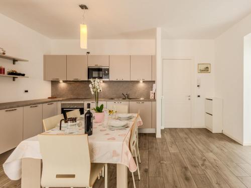 a kitchen and dining room with a table and chairs at Apartment Il Melo-2 by Interhome in Garzeno
