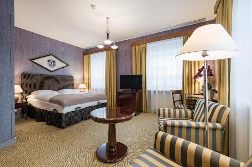 Postel nebo postele na pokoji v ubytování Grand Hotel Viljandi