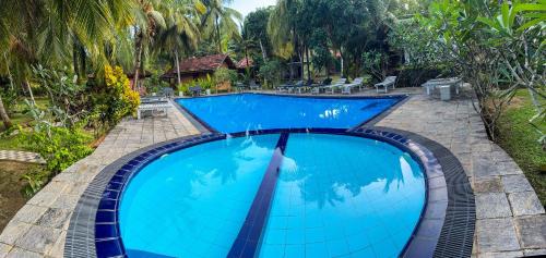 an image of a swimming pool at a resort at Goyambokka Beach Retreat in Tangalle