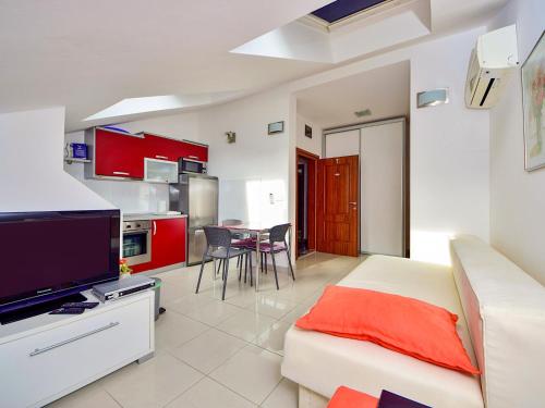 a living room with a bed and a kitchen at Apartment Jasmina-4 by Interhome in Blace