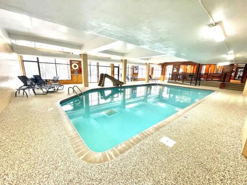 a large swimming pool in the middle of a building at Condo at Lutsen Mtn, Ski in Ski out, Gorgeous views of Moose Mtn in Lutsen