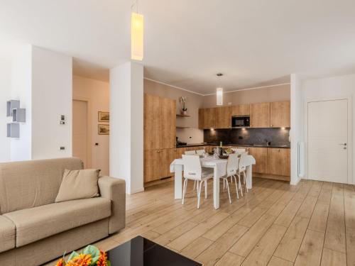 a living room and kitchen with a table and chairs at Apartment Il Melo-1 by Interhome in Garzeno