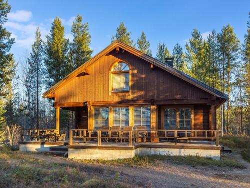 a log cabin in the woods with trees at Holiday Home Alakoski by Interhome in Ivalo