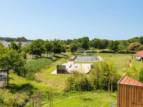 an aerial view of a garden with a playground at Apartment Jade et Elena-4 by Interhome in Lit-et-Mixe