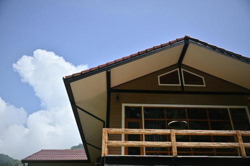 a view of a house with a porch at The Moonlight Guesthouse in Patong Beach