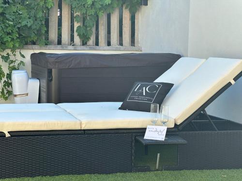a bed sitting on a table with a sign on it at Luxury Apartment Collection Sea Suite Jacuzzi in Passoscuro