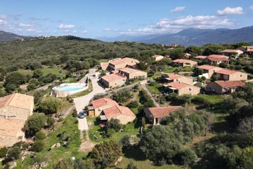 an aerial view of a villa with a pool and a house at APPA106 - Apartment F2 - 4 pers - Sea view - air conditioning - Swimming po in Serra-di-Ferro