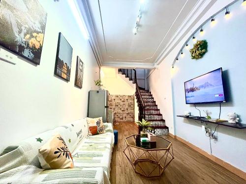 Μια τηλεόραση ή/και κέντρο ψυχαγωγίας στο Sora Home 3 Bedroom Balcony