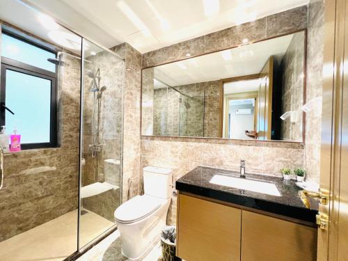 a bathroom with a toilet and a sink and a shower at R&F Princess Cove View Residences by WSD in Johor Bahru