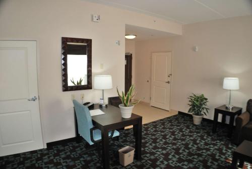 an office with a desk and a table and chairs at Hampton Inn & Suites Nashville at Opryland in Nashville