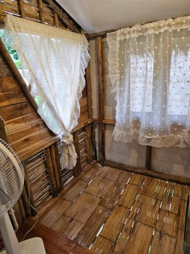 an inside view of a room with a window at PANAKLUEA Cottage & Crafts - พนาเกลือ in Ban Kham