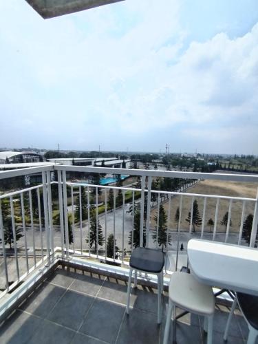 a balcony with a view of a parking lot at Nathans suites in Kaybagal
