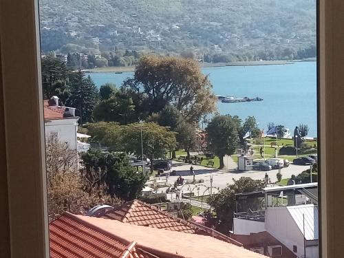 a view of a lake from a window at Villa OHRID -"LAKE VIEW" in Ohrid
