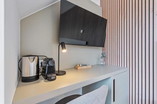 a kitchen with a counter with a coffee maker on it at Comfort & Style in Vibrant Luxembourg Coliving in Luxembourg