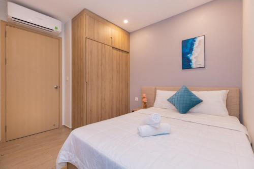 Кровать или кровати в номере MeoMeo Homestay - The Sóng Apartment