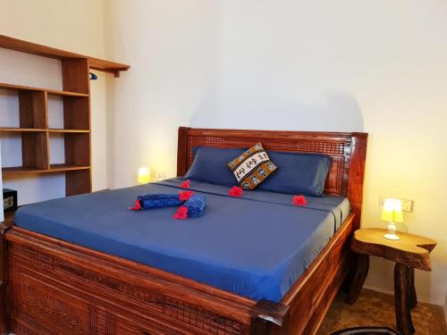Letto o letti in una camera di Apartments Zanz J&J Nungwi