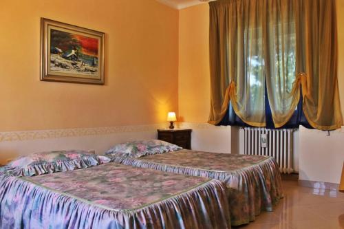 Postel nebo postele na pokoji v ubytování Hotel Ristorante La Torretta