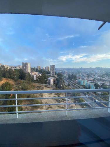 a view of a city from a balcony at Departamento nuevo moderno y elegante in Viña del Mar