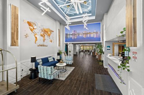 a lobby with a large screen in a building at Clarion Pointe Lakeland I-4 in Lakeland