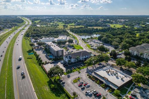 an aerial view of a city with a highway at Clarion Pointe Lakeland I-4 in Lakeland