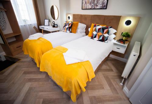 Ένα ή περισσότερα κρεβάτια σε δωμάτιο στο Apart Hotel Rugby -Self Check In-