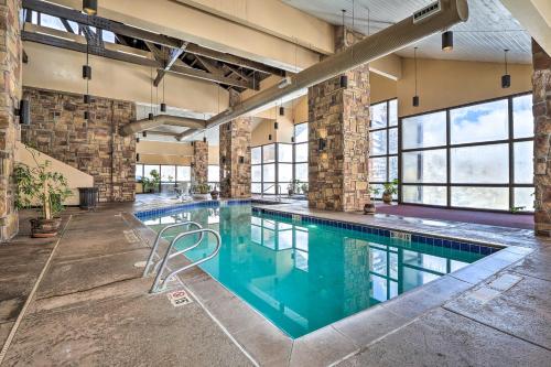 an indoor pool in a building with a swimming pool at Cozy Brian Head Condo Walk to Navajo Express Lift in Brian Head
