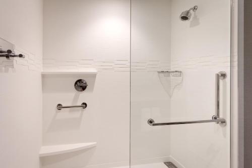 a shower with a glass door in a bathroom at Residence Inn by Marriott Flagstaff in Flagstaff