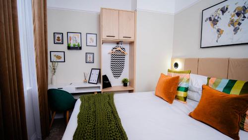 Ένα ή περισσότερα κρεβάτια σε δωμάτιο στο Apart Hotel Rugby -Self Check In-