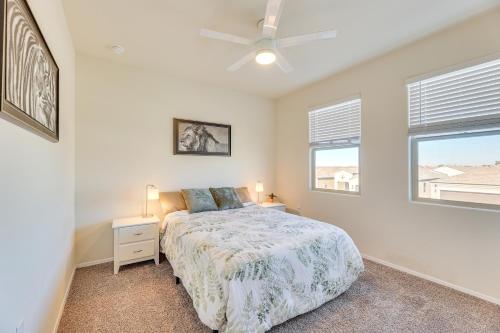 a bedroom with a bed and two windows at Family-Friendly Home with Playroom in San Tan Valley in San Tan Valley