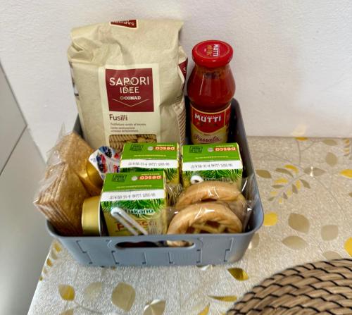 a basket filled with food sitting on a table at Appartamento Rimini Chanel in Rimini