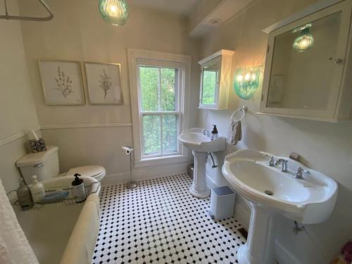 a white bathroom with a sink and a toilet and a sink at Trouvaille House Suite 3 Klimt Suite in Harpers Ferry