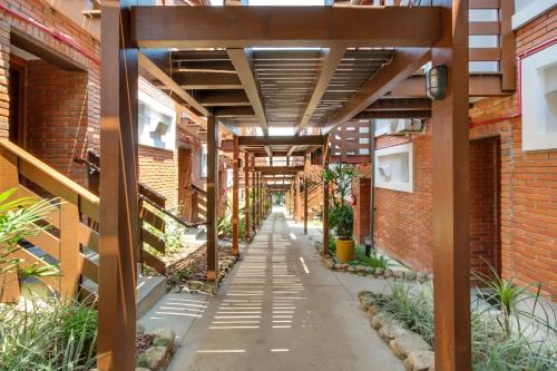 an internal walkway in a building with awnings at Pousada do Arvoredo in Bombinhas