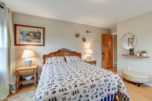 a bedroom with a bed and two tables with lamps at 1 Mi to Historic District Mtn-View Franklin Home in Otego